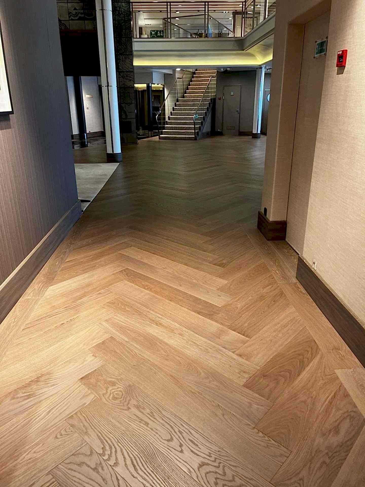 Winderen oversized herringbone in a cruise-ship ballroom.