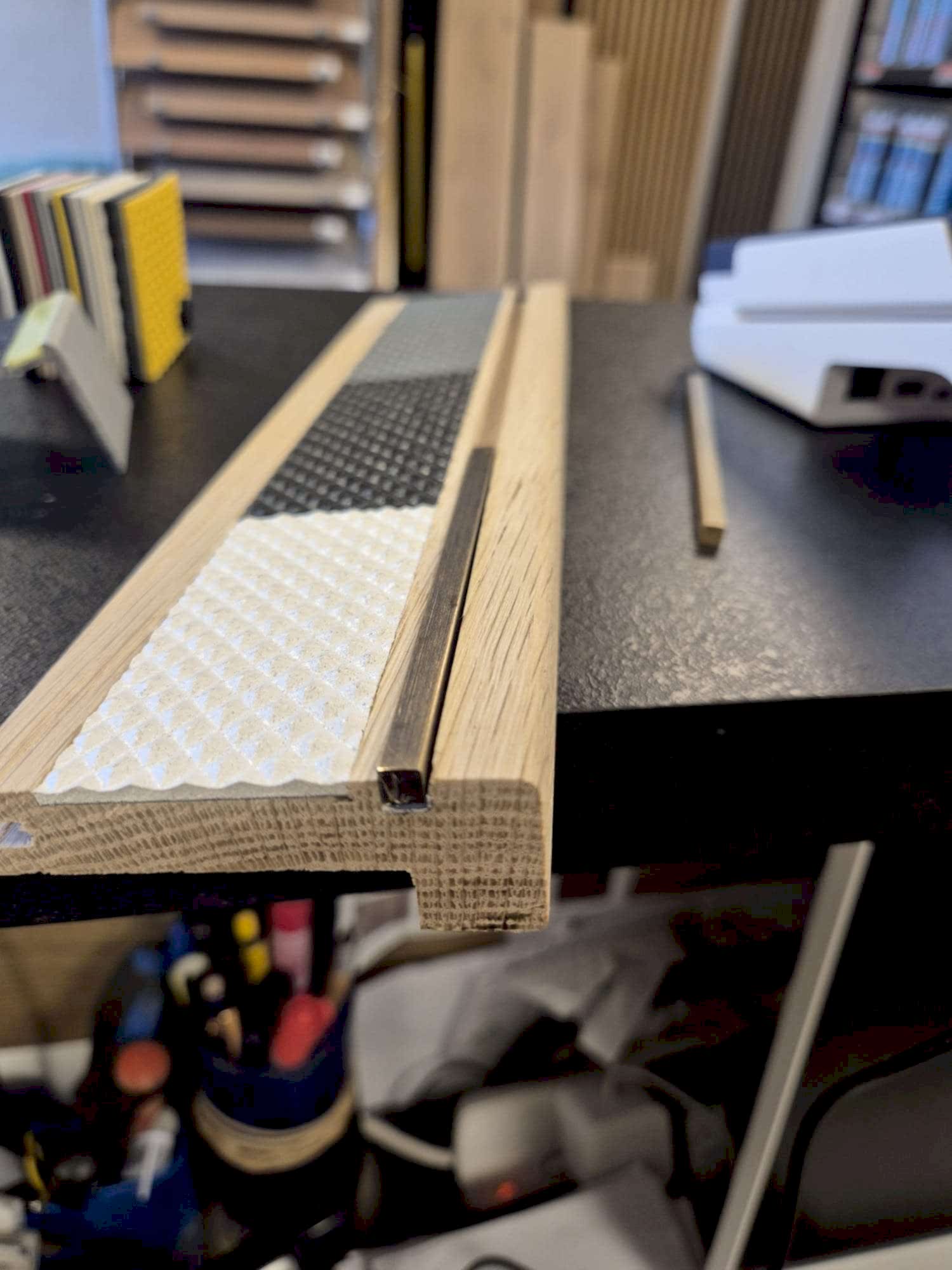 Oak stair nosing with anti-slip insert and solid brass insert